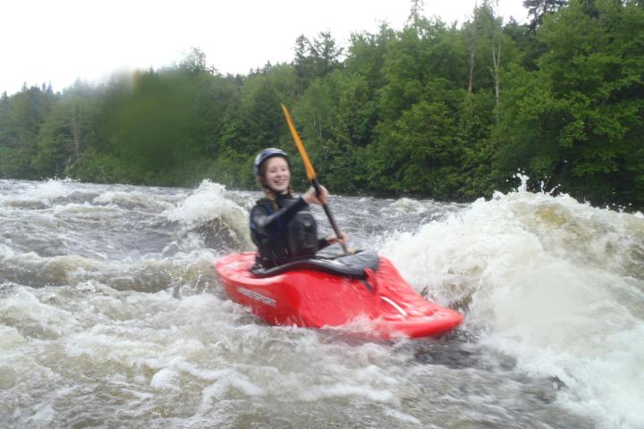 a man riding on a raft in a body of water