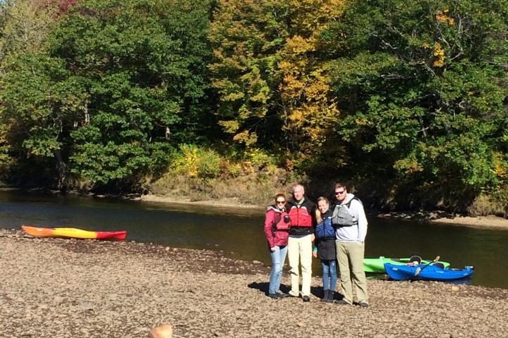 a group of people sitting at a beach