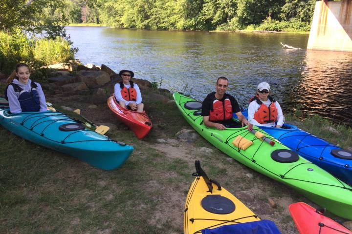 a group of people on a raft in a body of water