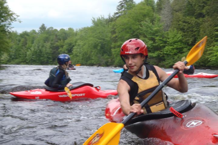 a person in a raft on the water