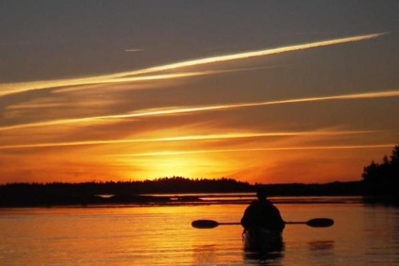 a sunset over a body of water