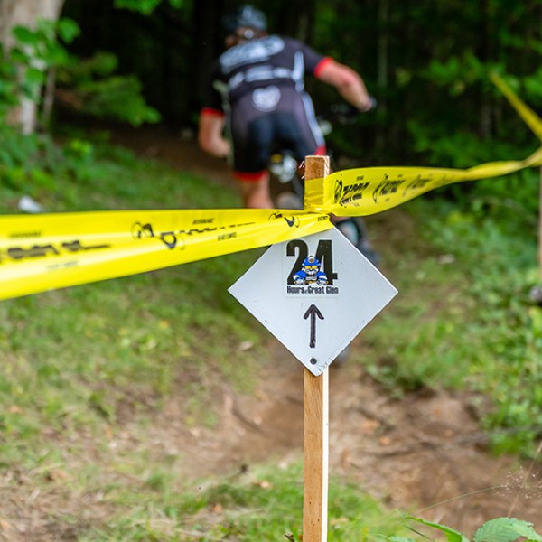 a sign on a dirt road
