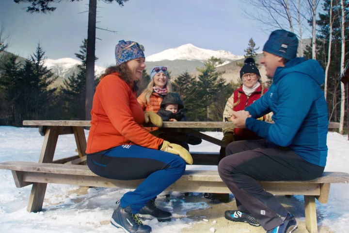 a man and a woman sitting on a bench
