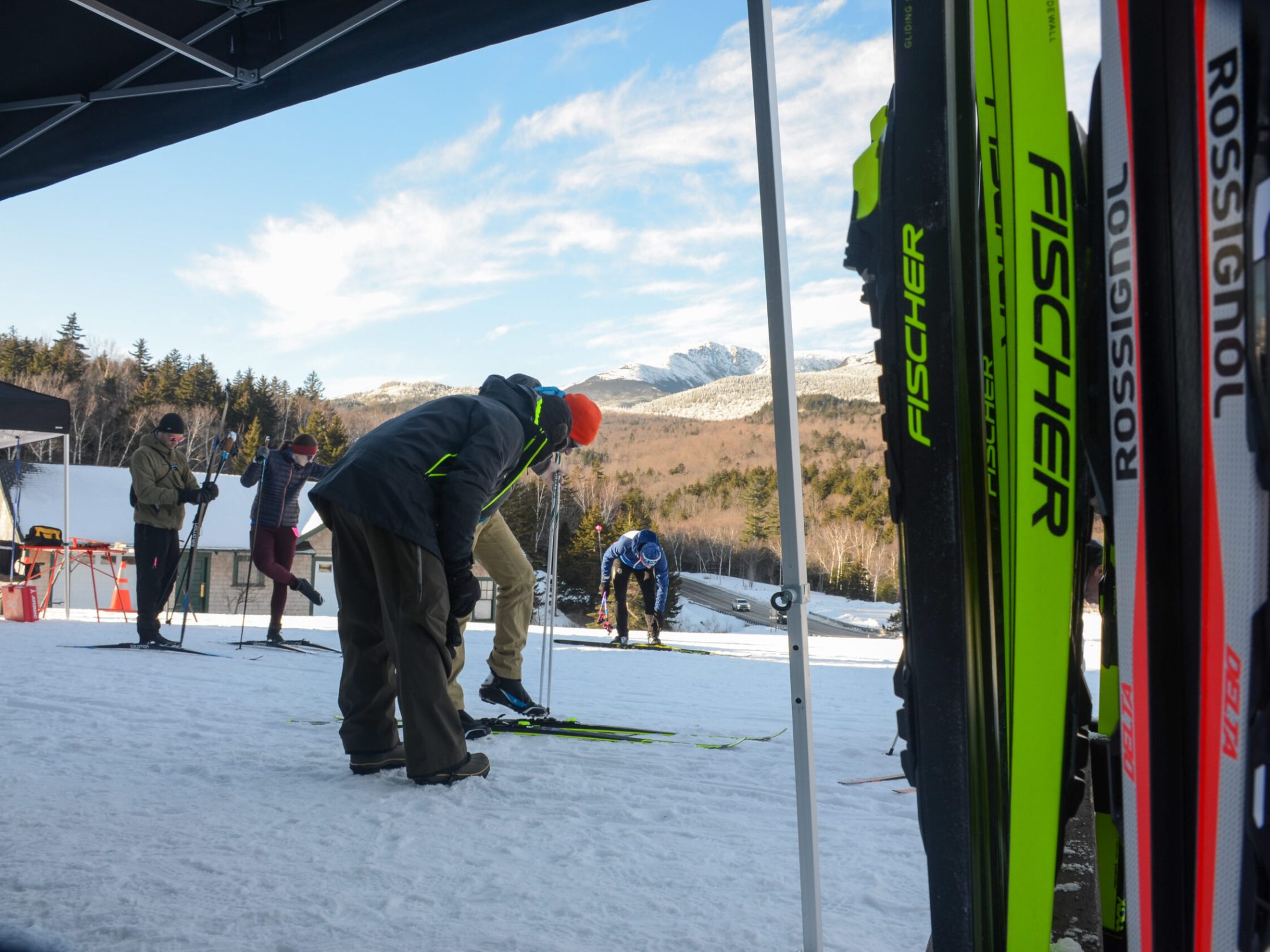 a couple of people that are standing in the snow