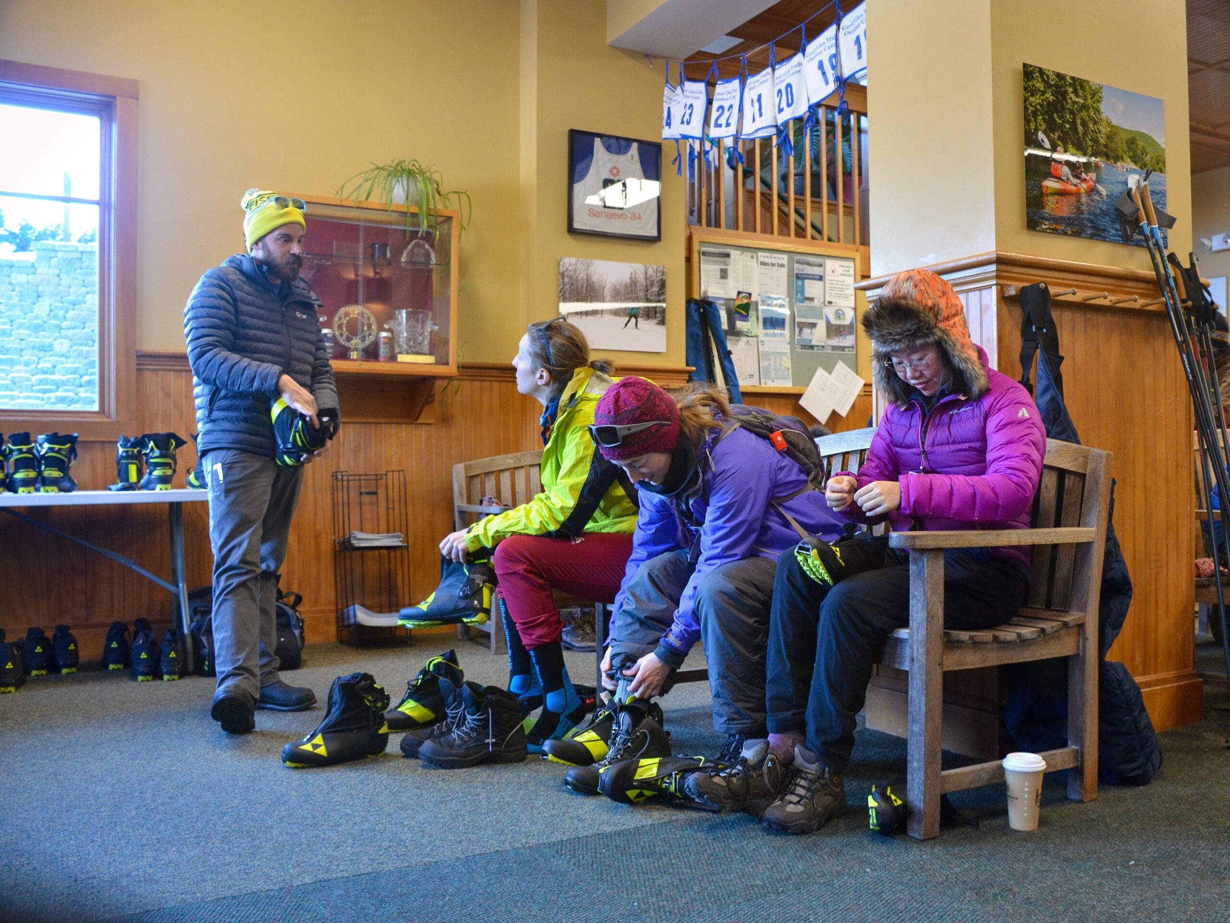 a group of people sitting around a living room
