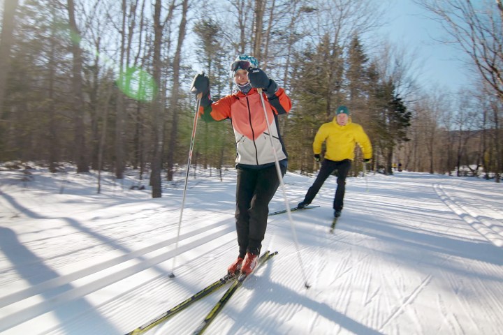 a person is cross country skiing in the snow