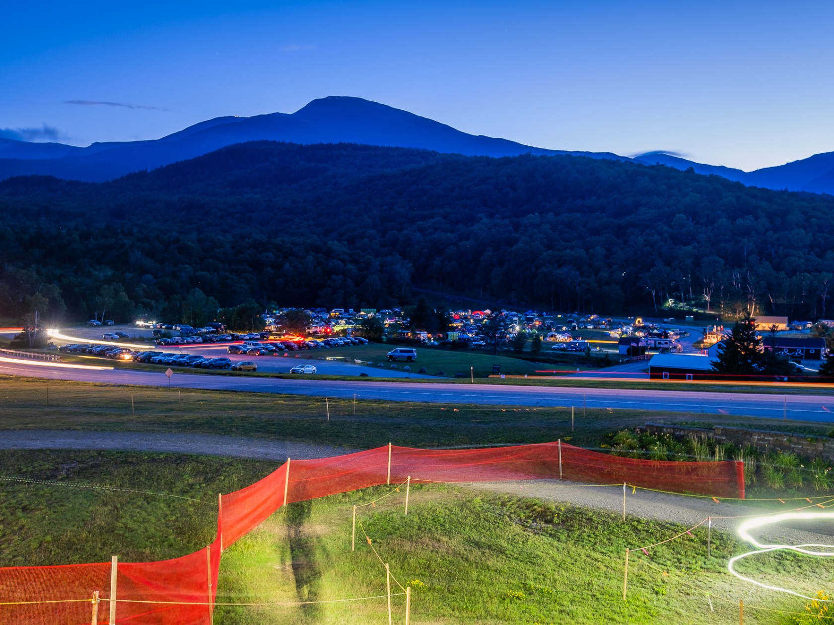 a body of water with a mountain in the background
