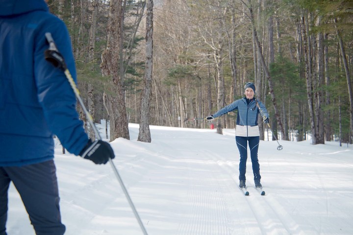 a person is cross country skiing in the snow
