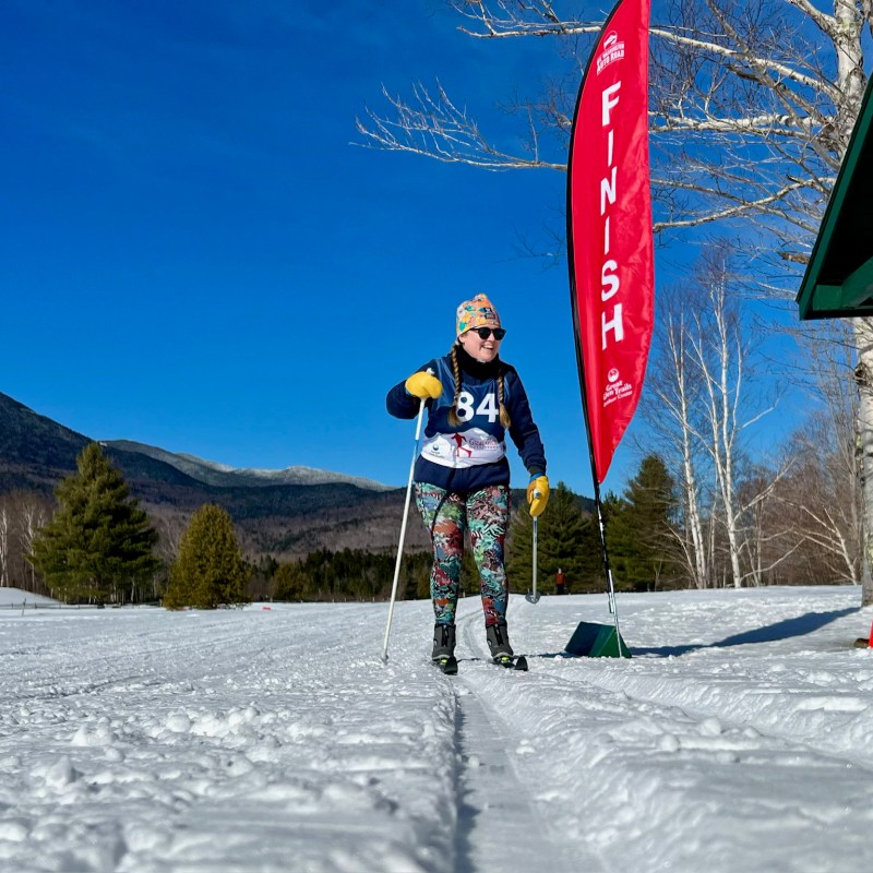 a couple of people that are standing in the snow