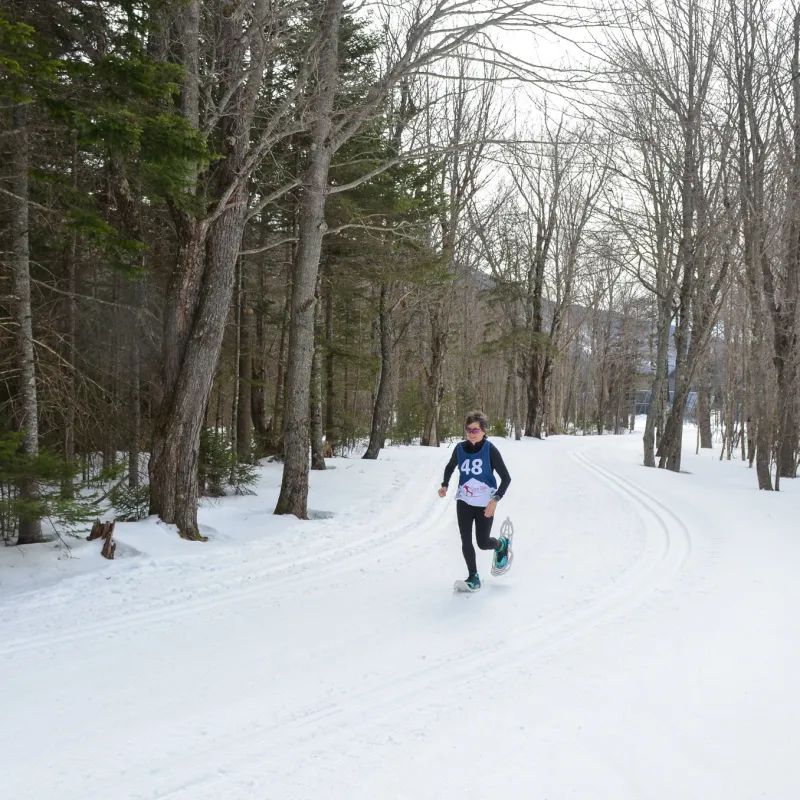 a person is snowshoeing in the snow